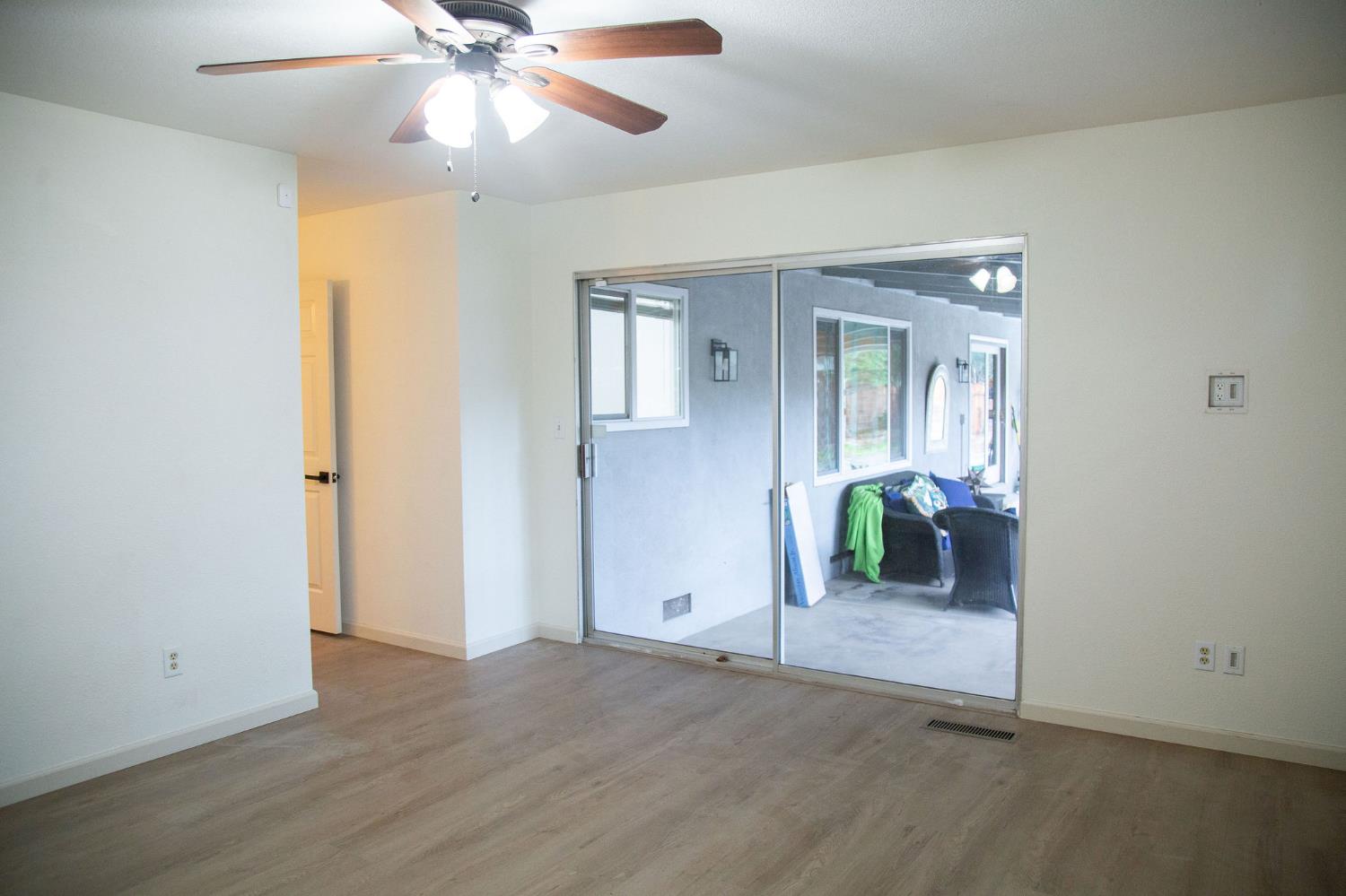 1208 Bristol Court Modesto, CA 95350 - Photo 31 of 40 Master bedroom with , a ceiling fan and a Slider to patio