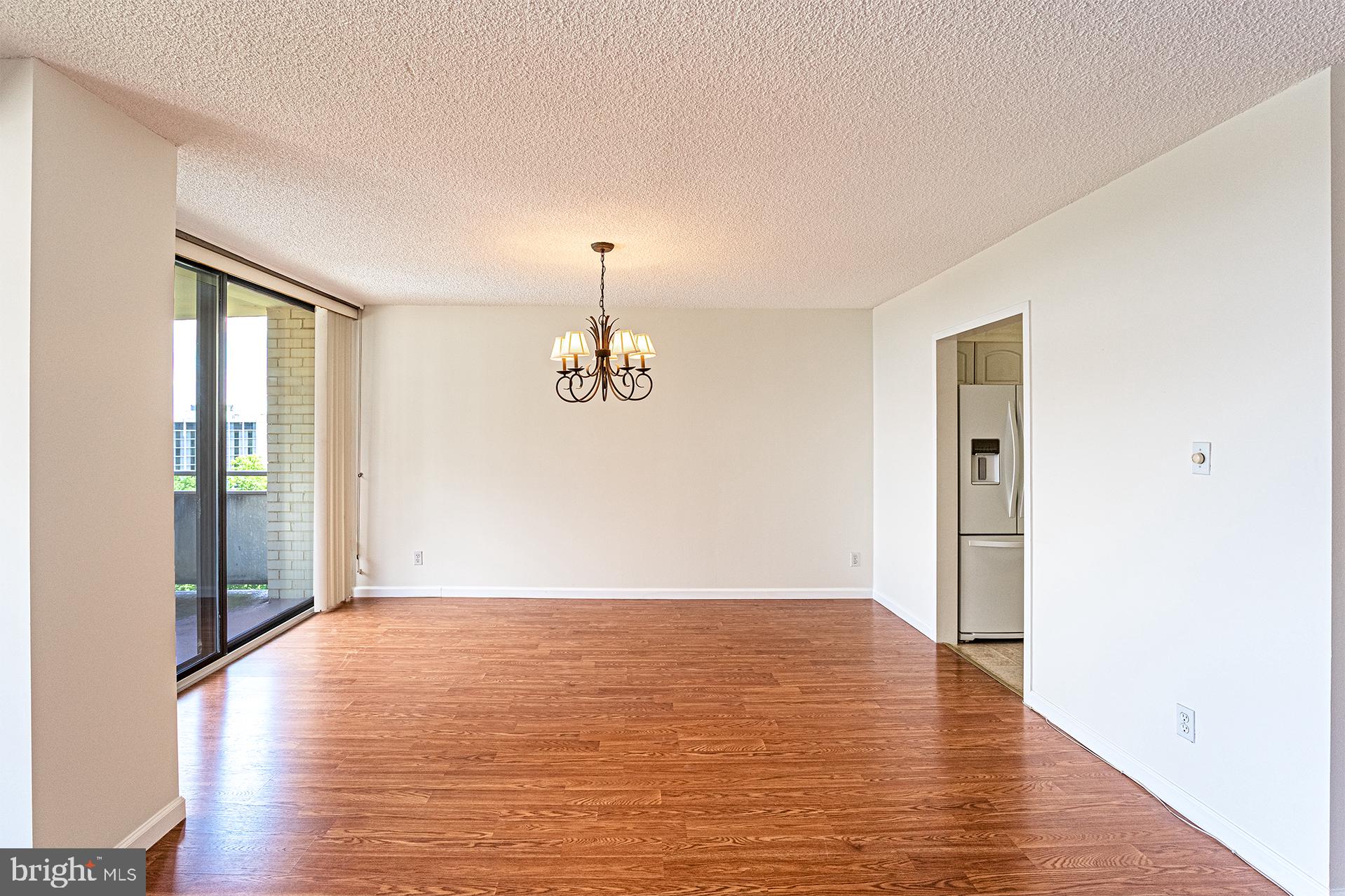 5225 Pooks Hill Road, Unit 721S Bethesda, MD 20814 - Photo 8 of 22 a view of empty room with wooden floor
