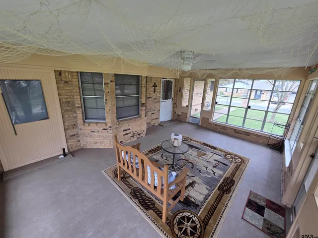 wooden floor with a large window in a room
