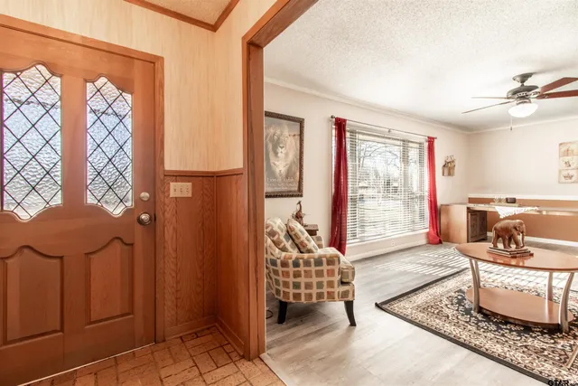 a living room with furniture and a window