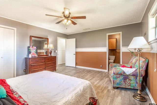 a bed room with a bed and a chandelier