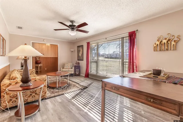 a workspace with furniture window and wooden floor