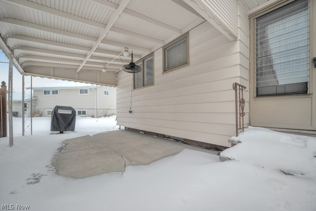 6846 Revere Road Cleveland, OH 44130 - Photo 8 of 30 View of snow covered garage
