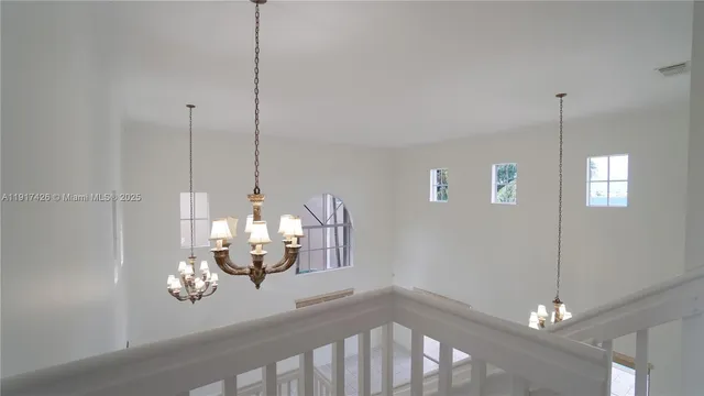 a view of a lake with a table and chairs