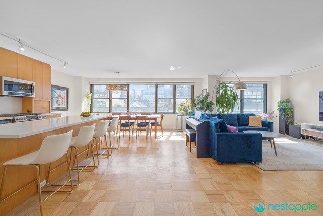 a living room with furniture and a large window