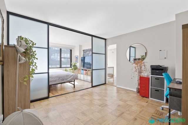 7 East 14th Street, Unit 1009 Manhattan, NY 10003 - Photo 7 of 13 a bedroom with furniture and natural light