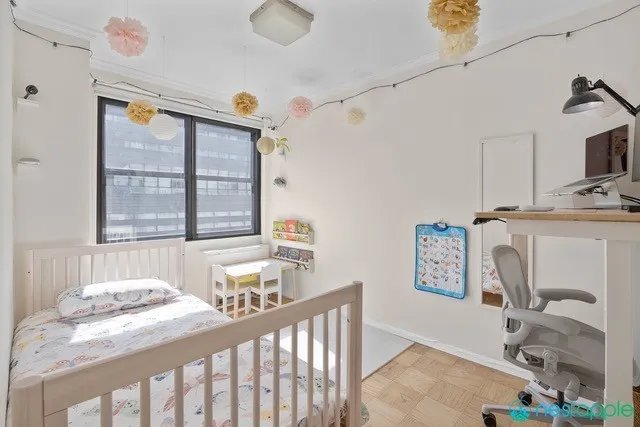 a bedroom with furniture and a window