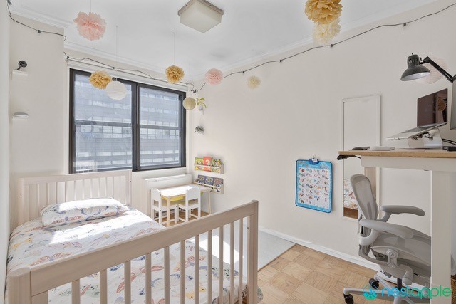 7 East 14th Street, Unit 1009 Manhattan, NY 10003 - Photo 9 of 13 a bedroom with furniture and a window