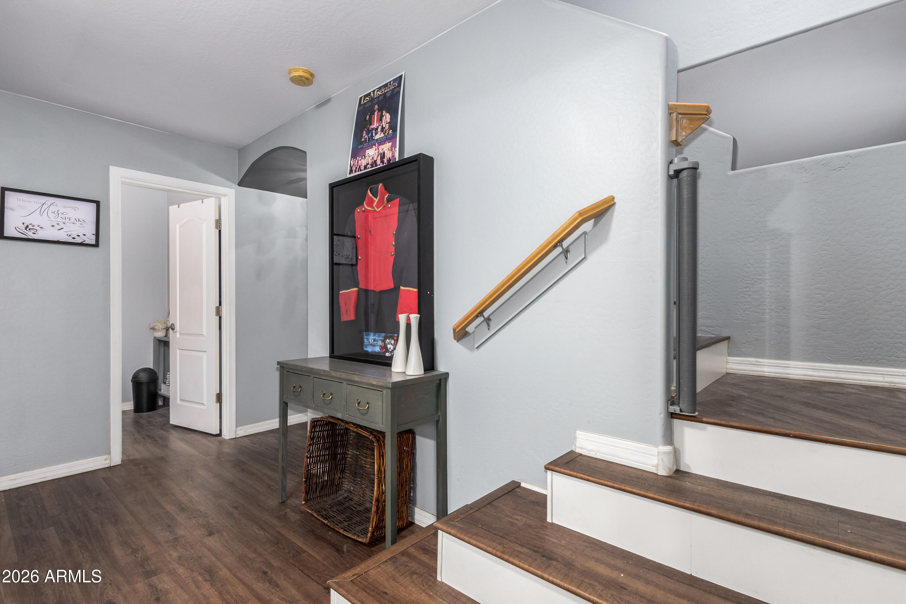 907 South Henry Lane Gilbert, AZ 85296 - Photo 7 of 25 a view of a hallway with wooden floor and staircase