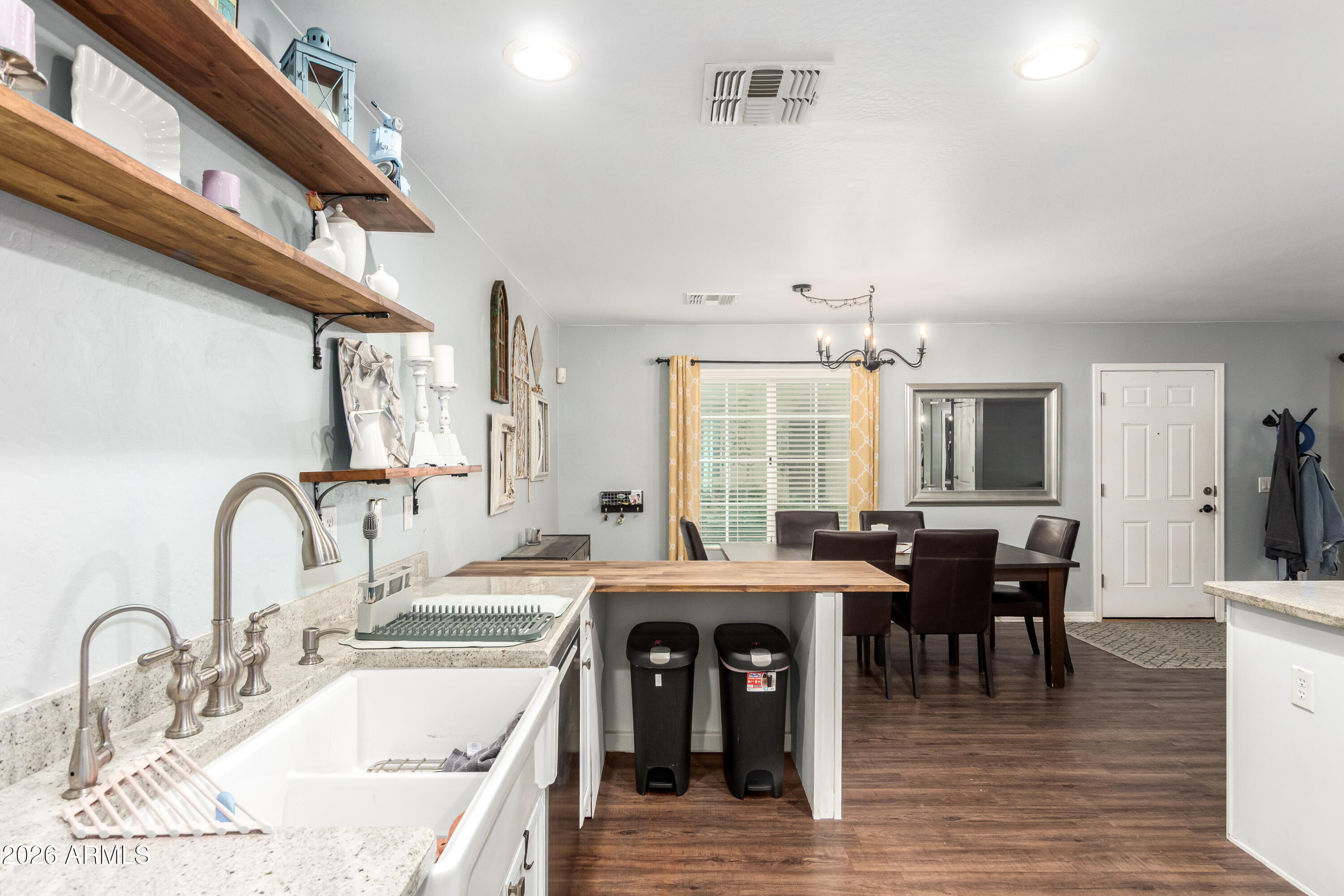 907 South Henry Lane Gilbert, AZ 85296 - Photo 9 of 25 a kitchen with stainless steel appliances granite countertop a sink and cabinets