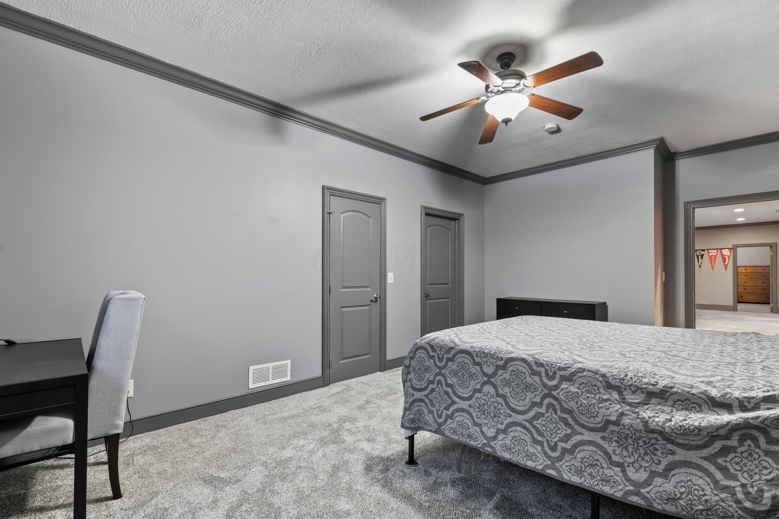 6043 Dublin Road Delaware, OH 43015 - Photo 61 of 98 • New grey carpet ~ 2021
• Grey painted walls
• Crown molding
• Lighted ceiling fan
• Egress window
• Single door closet
