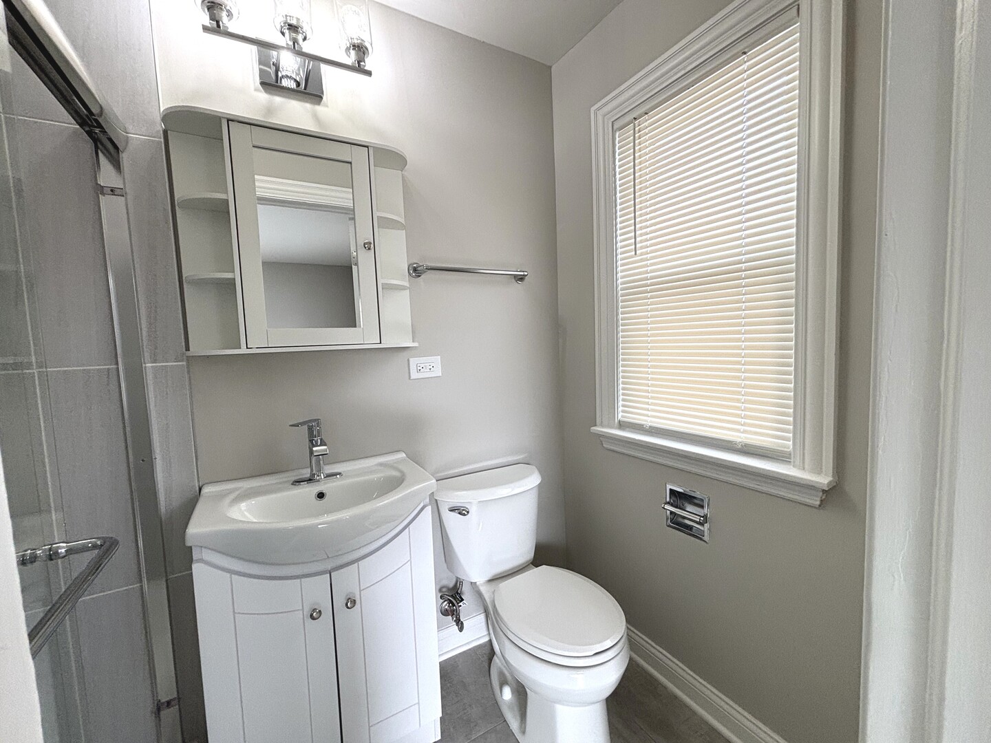 17092 Lincoln Street Hazel Crest, IL 60429 - Photo 14 of 20 a bathroom with a sink toilet and a mirror