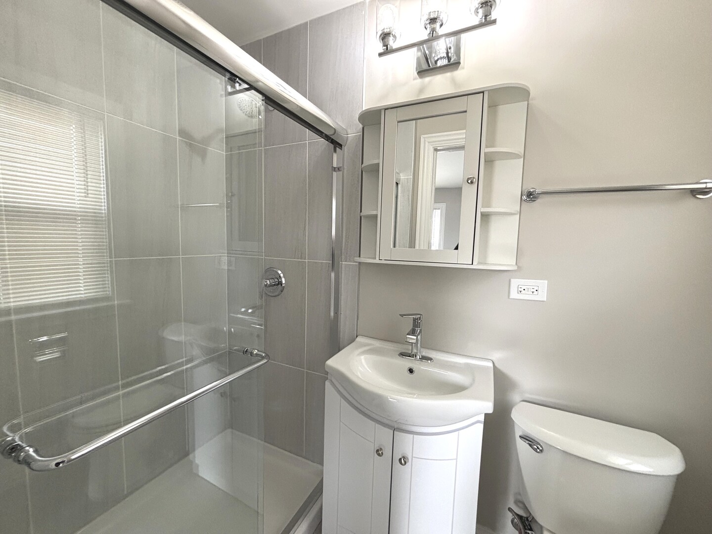 17092 Lincoln Street Hazel Crest, IL 60429 - Photo 15 of 20 a bathroom with a sink a toilet and shower