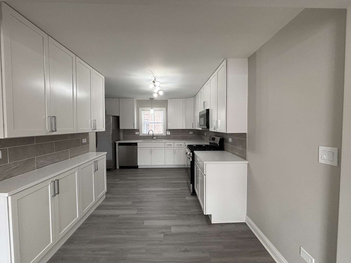17092 Lincoln Street Hazel Crest, IL 60429 - Photo 7 of 20 a kitchen with stainless steel appliances granite countertop a stove a sink and a refrigerator