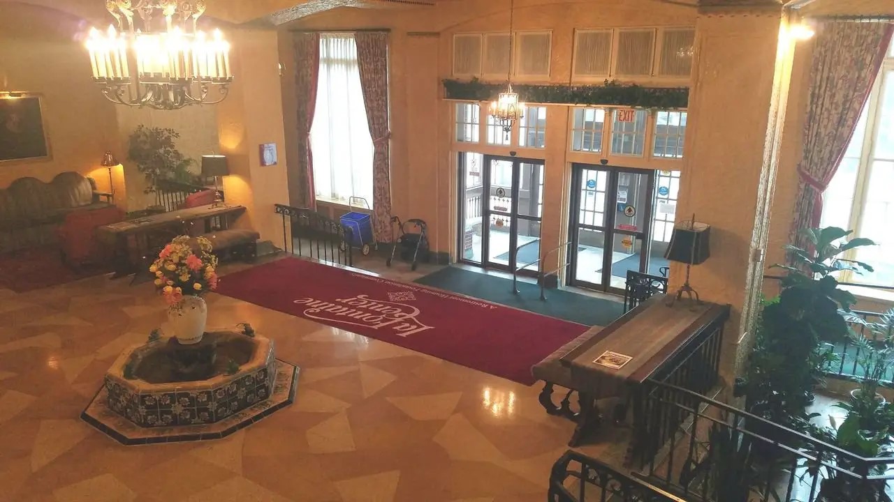 208 West State Street Huntington, IN 46750 - Photo 3 of 12 a living room with furniture and a floor to ceiling window