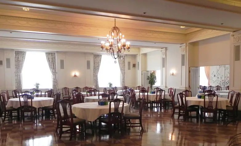 208 West State Street Huntington, IN 46750 - Photo 7 of 12 a view of a dining room with furniture and chandelier