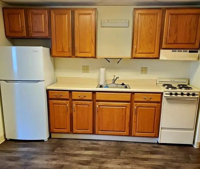 208 West State Street Huntington, IN 46750 - Photo 10 of 12 a kitchen with stainless steel appliances granite countertop a refrigerator stove and sink with cabinets