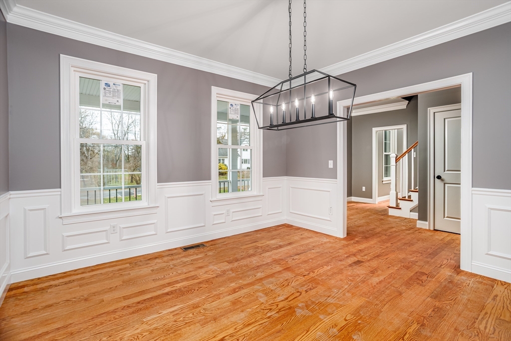 44 Nod Road Groton, MA 01450 - Photo 12 of 42 a view of an empty room with wooden floor and a window