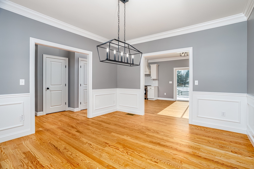 44 Nod Road Groton, MA 01450 - Photo 13 of 42 a bedroom with a bed and wooden floor