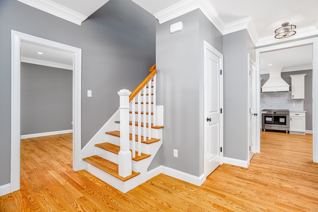 44 Nod Road Groton, MA 01450 - Photo 15 of 42 a view of a bedroom with wooden floor and white cabinet