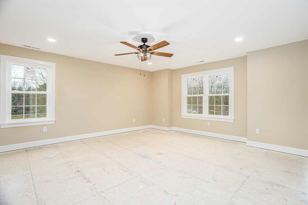 44 Nod Road Groton, MA 01450 - Photo 17 of 42 an empty room with windows and fan