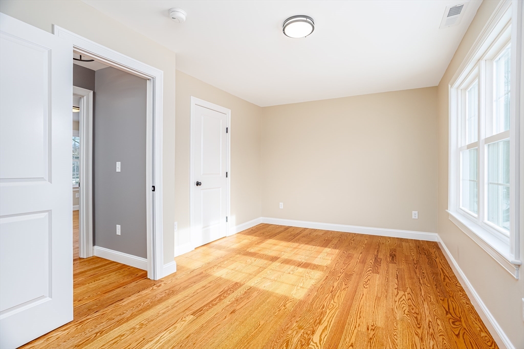 44 Nod Road Groton, MA 01450 - Photo 27 of 42 a view of empty room with wooden floor and fan