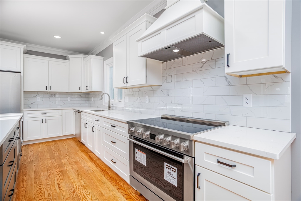 44 Nod Road Groton, MA 01450 - Photo 6 of 42 a kitchen with granite countertop a stove sink and cabinets