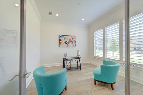 a view of a livingroom with furniture window and wooden floor