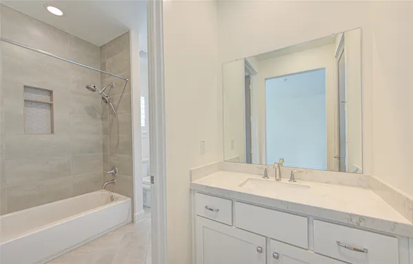 an empty room with a window and a sink