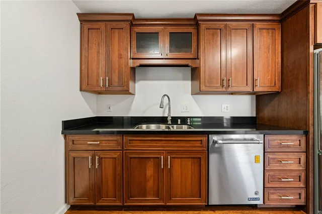a view of a windows and a kitchen with wooden floor