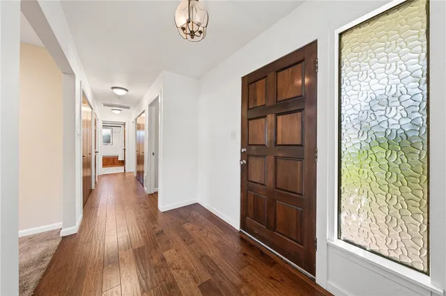 a view of room with window and ceiling fan