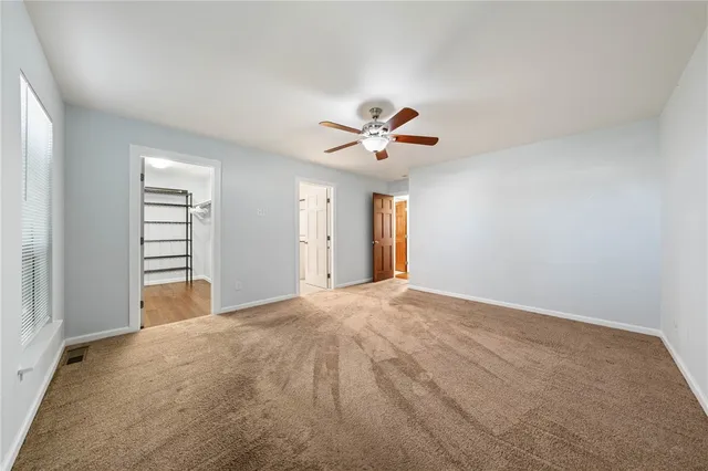 a bathroom with a sink a toilet a mirror and shower
