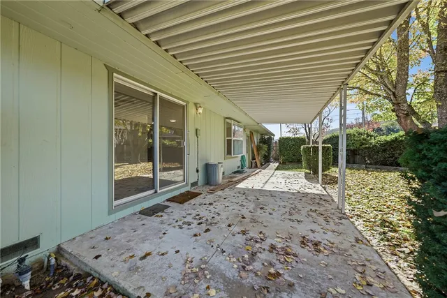 an aerial view of residential houses with outdoor space and street view