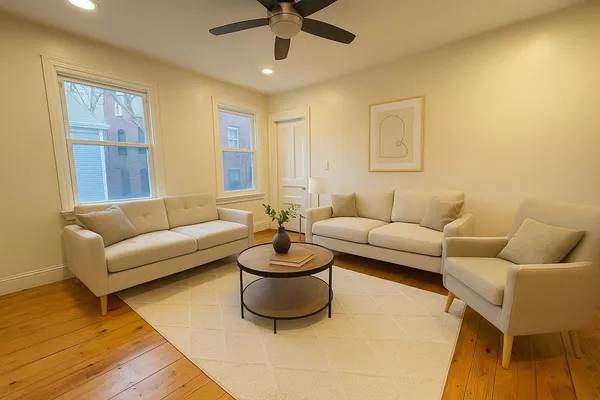 a living room with furniture and a rug