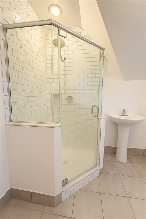 21 Highland Street, Unit 2 Boston, MA 02119 - Photo 9 of 9 a bathroom with a shower and toilet