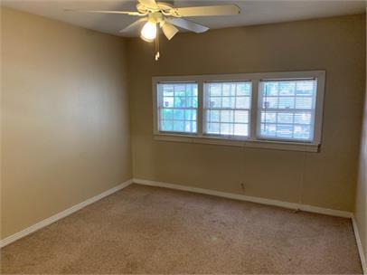 2411 30th Street Lubbock, TX 79411 - Photo 13 of 25 an empty room with a window