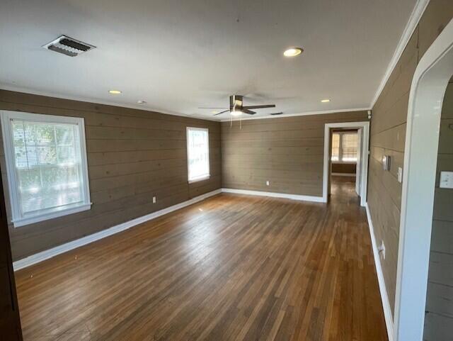 2411 30th Street Lubbock, TX 79411 - Photo 22 of 25 an empty room with wooden floor and windows