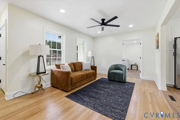 a living room with furniture and a rug