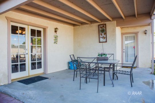 1112 Lee Avenue Ridgecrest, CA 93555 - Photo 26 of 29 a view of a dining room with furniture and wooden floor