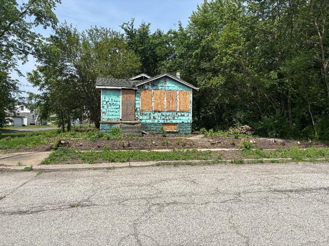 982 Ralston Street Gary, IN 46406 - Photo 5 of 5 a house with trees in the background