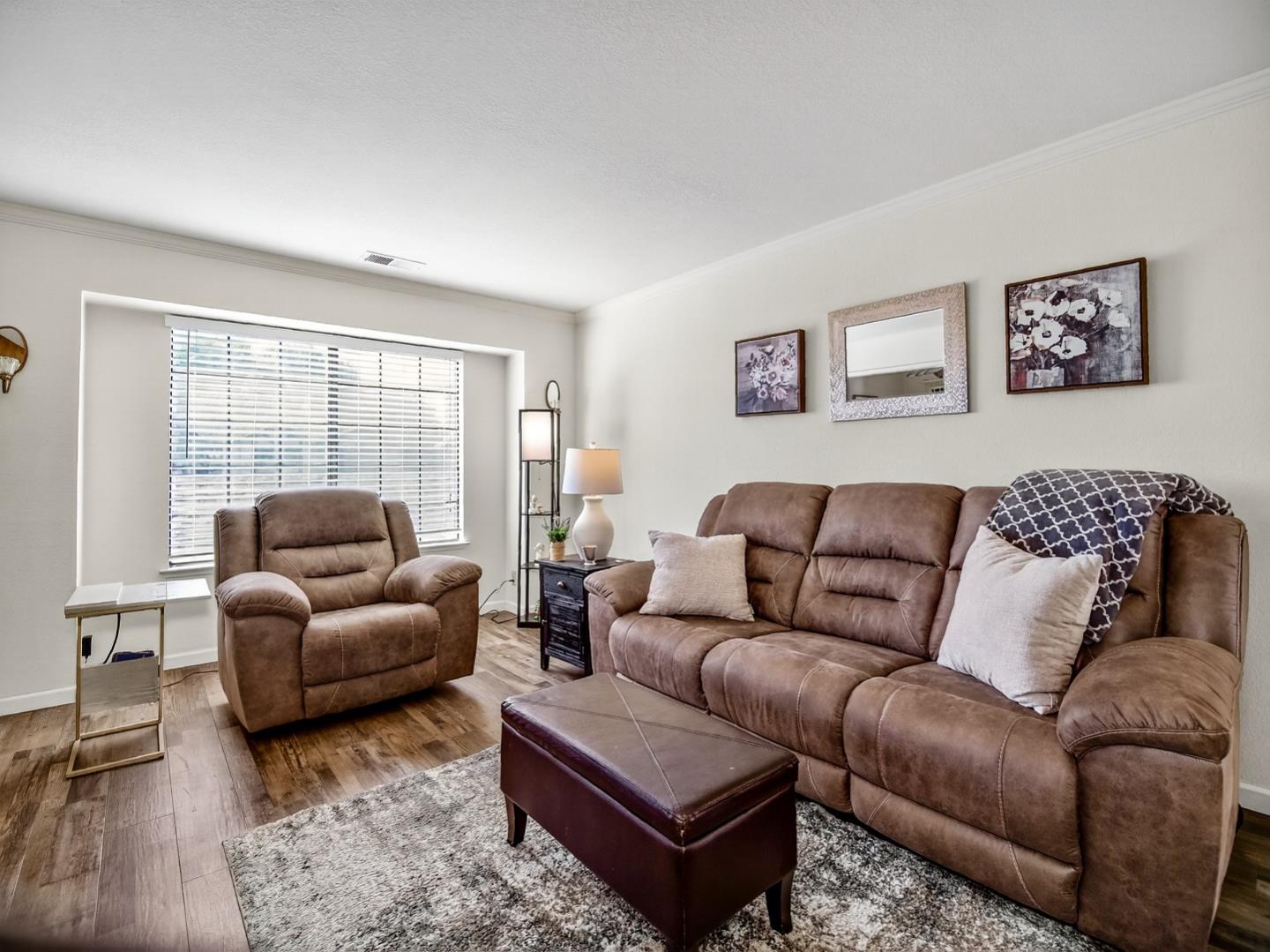 1056 Padre Drive, Unit 8 Salinas, CA 93901 - Photo 18 of 43 a living room with furniture and a large window