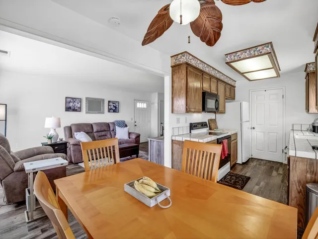 a kitchen with stainless steel appliances a stove a sink and a microwave