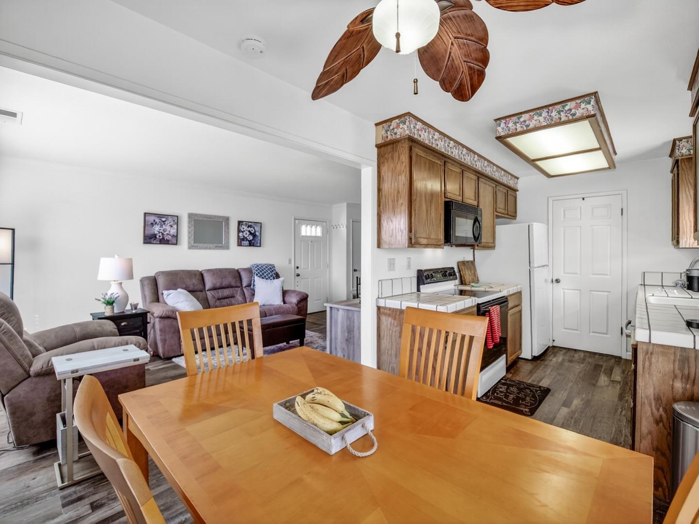 1056 Padre Drive, Unit 8 Salinas, CA 93901 - Photo 20 of 43 a bedroom with furniture and a wooden floor