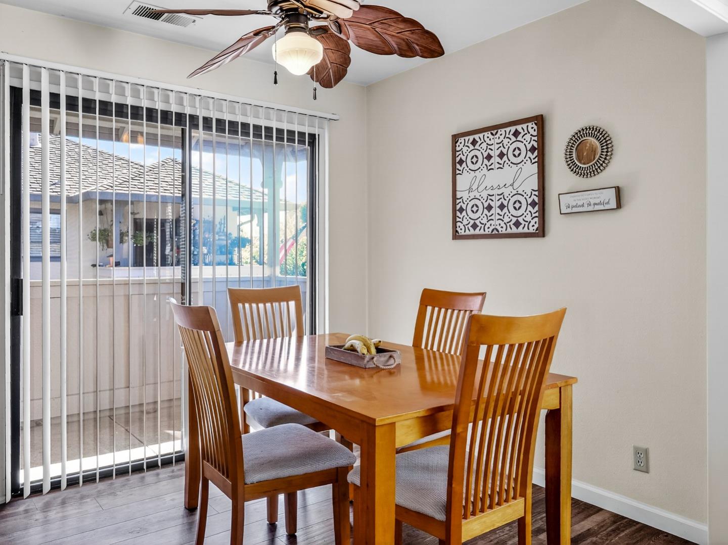1056 Padre Drive, Unit 8 Salinas, CA 93901 - Photo 25 of 43 a view of a dining room with furniture window and wooden floor