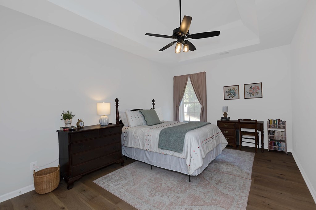 6712 Bridge Way Columbus, GA 31904 - Photo 29 of 36 a bedroom with a bed and dresser with mirror