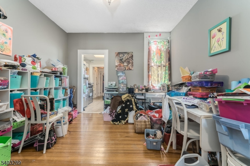 49 Caldwell Place, Unit 5 Springfield, NJ 07081 - Photo 13 of 41 a living room with furniture and a wooden floor
