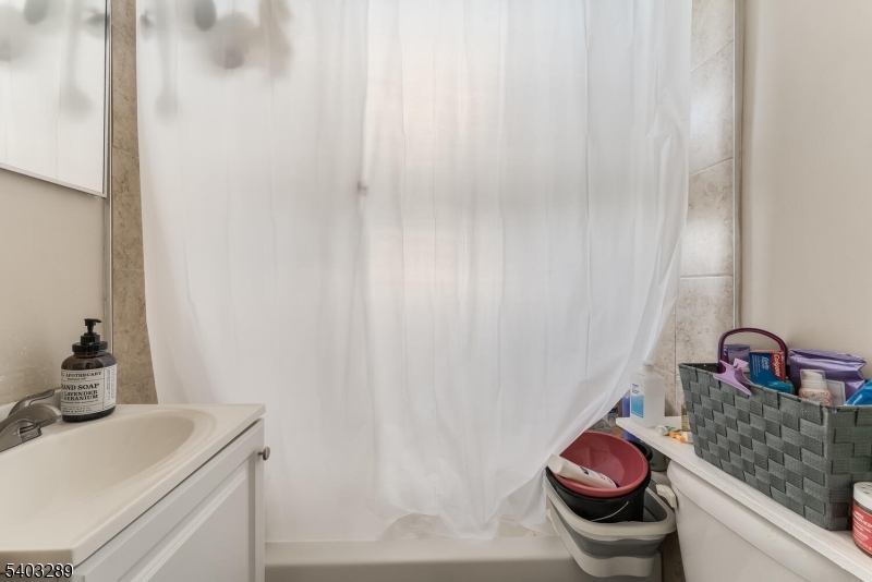 49 Caldwell Place, Unit 5 Springfield, NJ 07081 - Photo 18 of 41 a bathroom with a sink and toilet