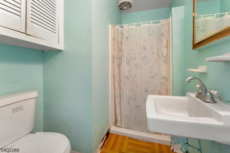 49 Caldwell Place, Unit 5 Springfield, NJ 07081 - Photo 28 of 41 a bathroom with a sink a toilet and shower