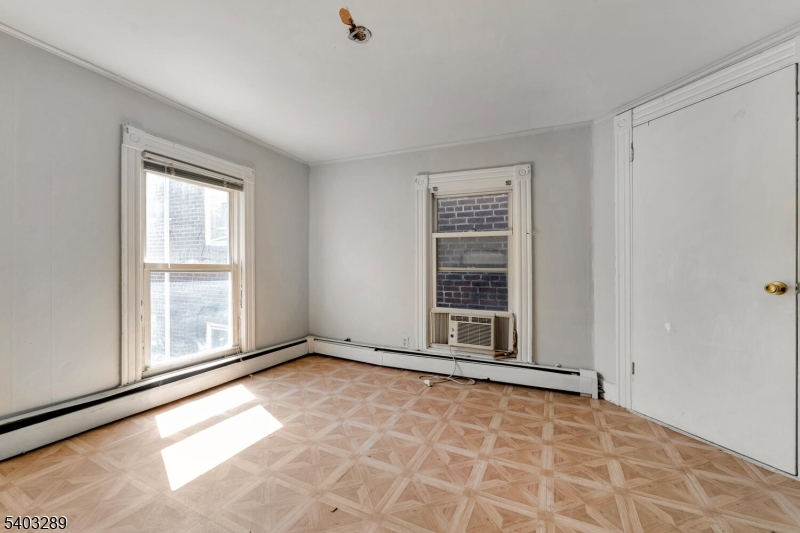 49 Caldwell Place, Unit 5 Springfield, NJ 07081 - Photo 33 of 41 a view of an empty room with a window