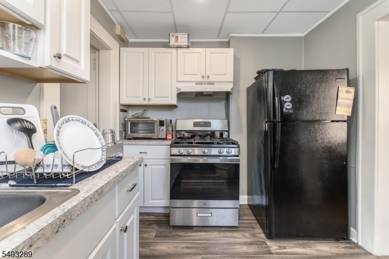 49 Caldwell Place, Unit 5 Springfield, NJ 07081 - Photo 10 of 41 a kitchen with stainless steel appliances granite countertop a refrigerator a stove and a sink